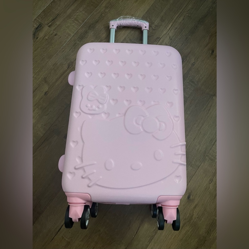 HELLO KITTY-Imported (NWT) Pink Carry-On Luggage with Multi-Directional Wheels
